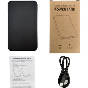 A black power bank with a sleek design, accompanied by a user manual and a USB charging cable.