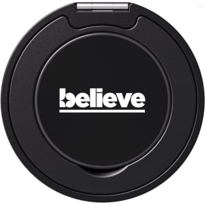A black phone grip and stand with a circular design and a logo on its surface.