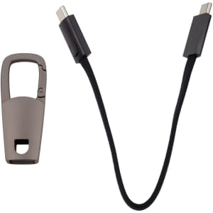 A brown carabiner and a black charging cable with USB-C connectors on both ends.