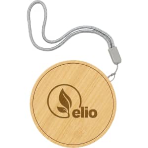 A round, bamboo wireless charger with a grey strap and a logo. The design features a natural wood finish.
