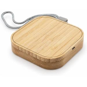 A square wireless charger made of bamboo with a grey fabric cord, featuring a modern design and a logo.