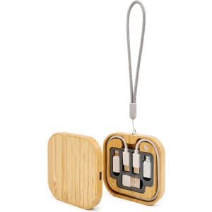A wooden square wireless charger set in a bamboo finish, featuring compartments for charging cables and a hanging loop.