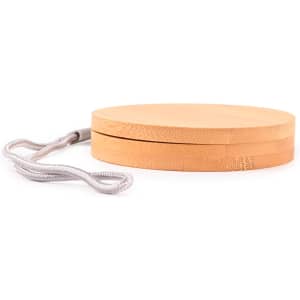 A circular bamboo cable organizer with a textured surface and a grey strap for easy carrying.