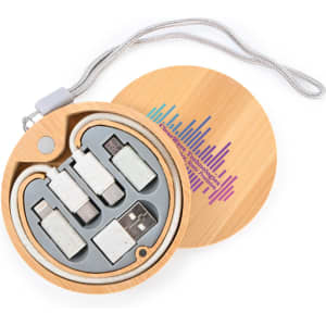 A wooden circular case containing multiple charging cables in grey and white, featuring a logo on the exterior.
