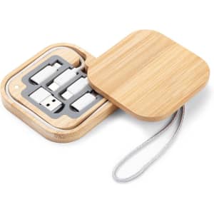 A Reveal Square Cable Set in a bamboo case, featuring multiple charging cables neatly stored inside.