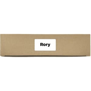 A brown cardboard box with a label on the front. The box is closed and unmarked aside from the label.