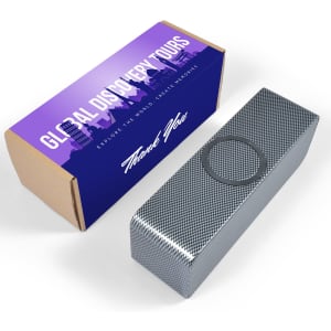 A silver speaker with a metallic finish is displayed beside a colourful box featuring a logo and text.