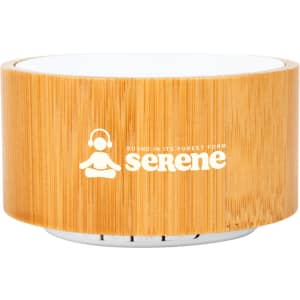 A bamboo Bluetooth speaker featuring a round design and a white top, with a logo displayed on the front.