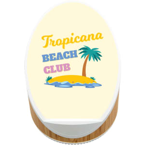 A wireless speaker and charger featuring a beach-themed design with a palm tree and island motif. The base is made of bamboo.