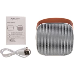 A compact Boombox Mini Speaker with a sleek design, accompanied by a user manual and a USB charging cable.