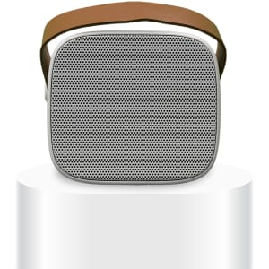 A Boombox Mini Speaker with a sleek design, featuring a mesh front and a brown strap for portability.
