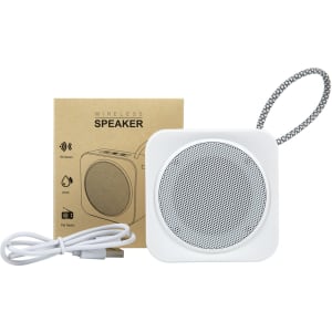 A white square wireless speaker with a textured front, accompanied by a box and a charging cable, featuring a logo.