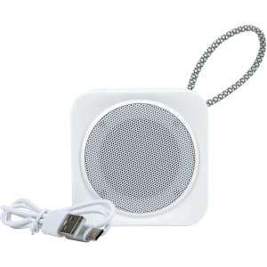 A white Pep Mini Speaker with a textured carry strap and a USB charging cable.