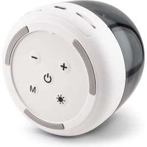 A round Dazzle RGB Speaker in white and black, featuring control buttons and a logo.