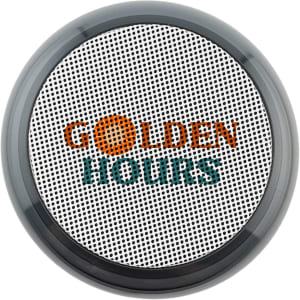 A round, black and silver speaker with a textured surface and a logo on the front.
