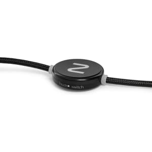 A black charging cable with a round switch feature and a textured exterior. It includes a logo on the switch.