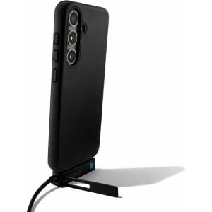 A black phone case with a stand and charging cable attached, featuring a camera cutout and buttons on the side.