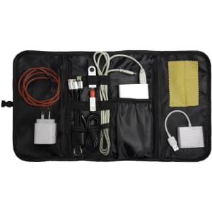 A black organizer containing various cables, chargers, and a cleaning cloth in a compact, zippered design.