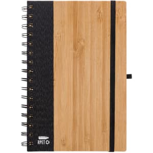 A spiral-bound A5 notebook with a bamboo cover and a black fabric side, featuring a black elastic band closure.