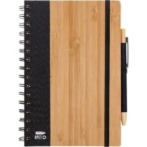 A bamboo and black spiral notebook with an elastic band and pen attached. It features a logo on the front cover.