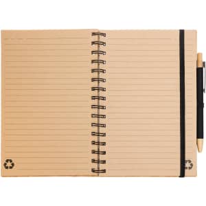A spiral-bound A5 notebook with a tan cover, lined pages, and a black pen attached. Features a recycling logo.