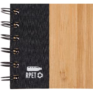 A black and bamboo spiral A5 notebook featuring a textured cover and a logo.