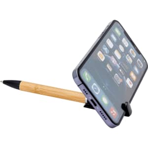 A bamboo pen holds a smartphone upright on a black stand, showcasing a clear phone screen.