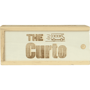 A wooden box with the words "THE Curto" engraved on it, featuring a simple vehicle graphic, light tan in colour.