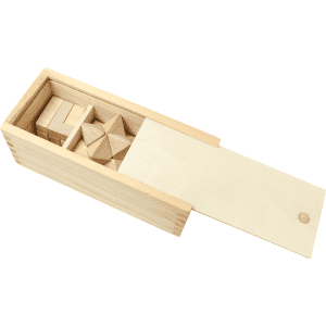 A wooden box containing a 3-piece brain teaser set with various geometric shapes. The box features a sliding lid.