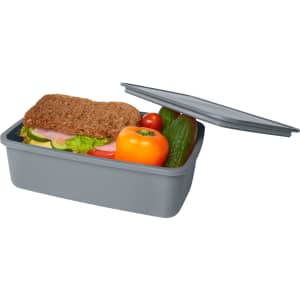 A grey lunch box containing a sandwich, tomato, cucumber, and bell pepper, with a lid partially open.