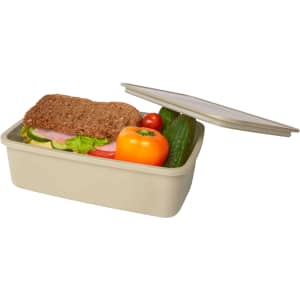 A beige lunch box containing a sandwich, tomato, cucumber, and capsicum, with a lid partially open.