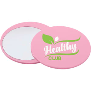 A pink circular makeup mirror with a glossy finish, featuring a logo and a reflective surface.