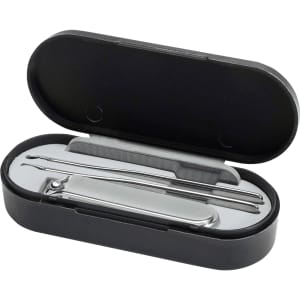 A sleek black manicure set containing nail clippers, a nail file, and a cuticle pusher in a compact case.