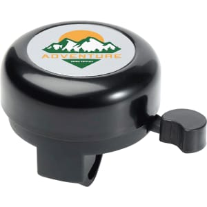 A black bicycle bell with a circular top featuring a logo and a lever on the side for ringing.