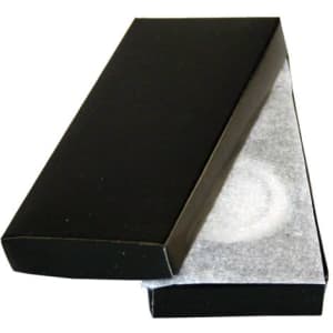 A black rectangular box partially opened, revealing a white cushioning material inside.