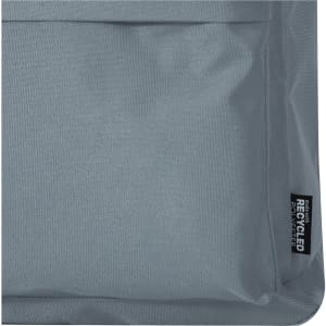 A grey fabric section of a laptop backpack featuring a logo and a textured surface.