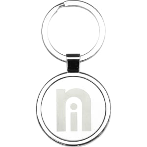 A silver metal keyring with a circular design and a logo in the centre.