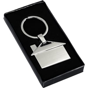 A silver house-shaped metal keyring in a black gift box. The keyring features a keyring loop for attachment.
