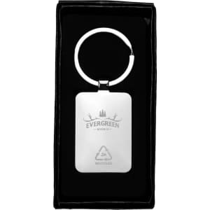 A rectangular zinc alloy keyring with a bamboo accent, presented in a black box. It features a logo.