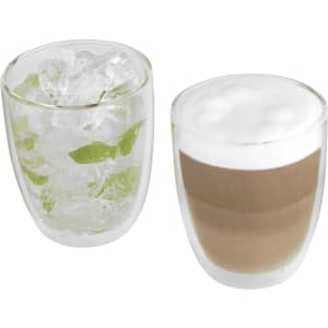 A glass coffee and tea set featuring two double-walled glasses, one with ice and mint, the other with a layered beverage.