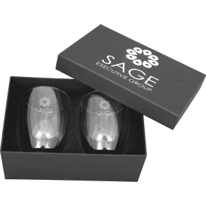 A glass coffee and tea set in a black gift box featuring a logo, with two clear glass cups inside.
