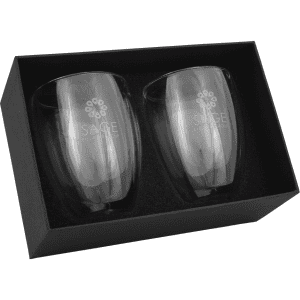 Two clear glass cups in an elegant box, showcasing a sleek design with a subtle logo, ideal for coffee or tea.