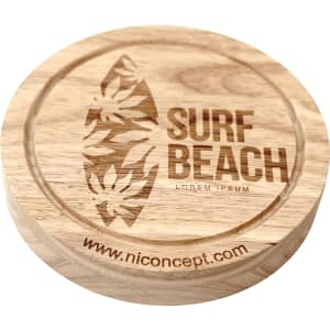 A round wooden cheese board featuring a surfboard design and floral accents, with an engraved logo.