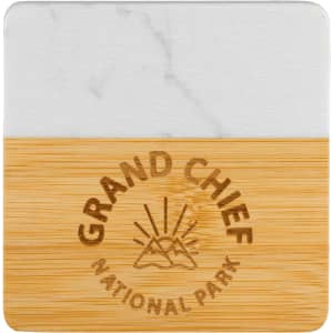 A marble and bamboo coaster featuring a white marble top and a bamboo bottom, with a logo on the surface.