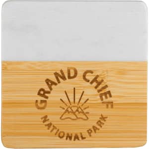 A marble and bamboo coaster featuring a light marble top and a bamboo base with an engraved logo.