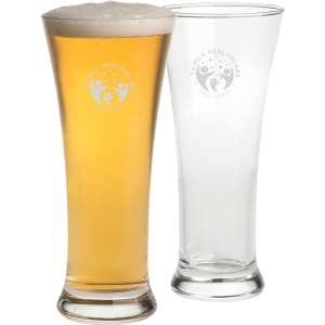 A Pilsner beer glass set featuring two glasses, one with beer and foam, both clear with a logo.