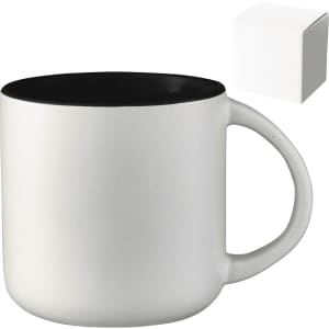 A ceramic mug with a white exterior and black interior, presented alongside a plain gift box.