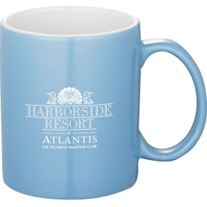 A blue ceramic mug with a handle and a logo printed on its side, featuring a white interior.
