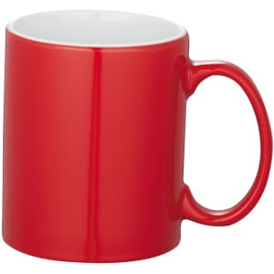 A red ceramic mug with a white interior and a curved handle, featuring a logo.