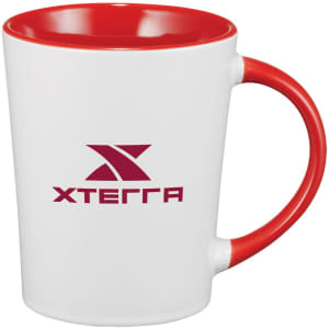 A coffee mug with a white body and a red handle and interior, featuring a logo on the side.